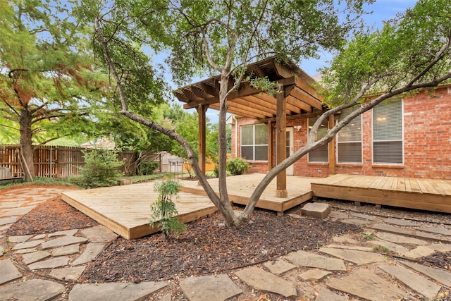 exterior space with a pergola and a deck