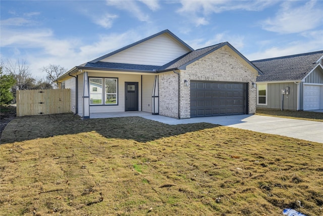 single story home featuring a garage and a front yard