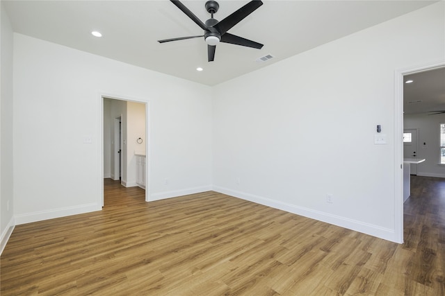 spare room featuring hardwood / wood-style flooring and ceiling fan