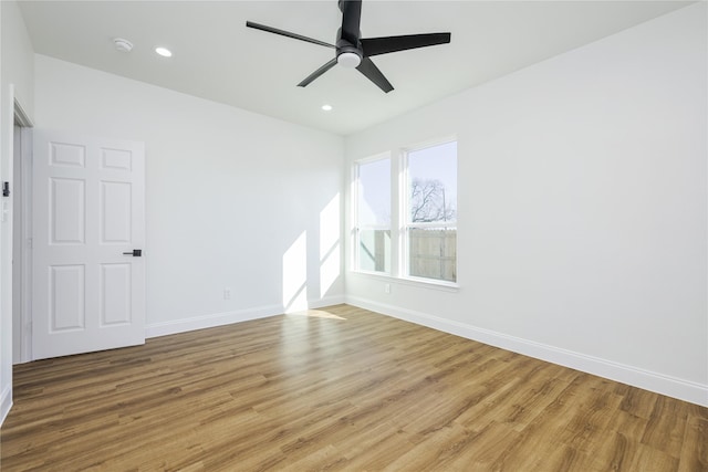 unfurnished room featuring hardwood / wood-style floors and ceiling fan