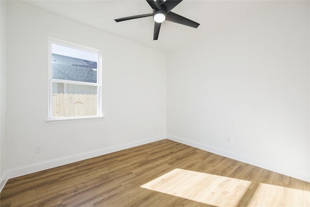 empty room featuring hardwood / wood-style floors and ceiling fan