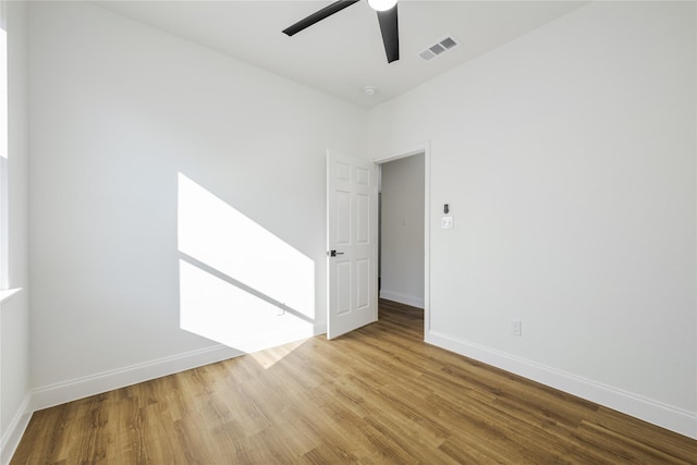 unfurnished room featuring ceiling fan and light wood-type flooring