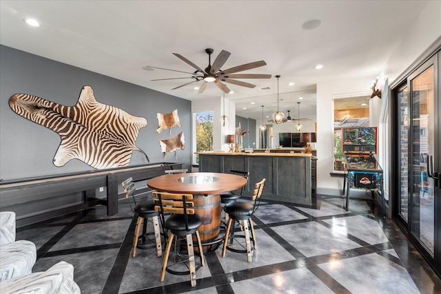 dining room featuring ceiling fan