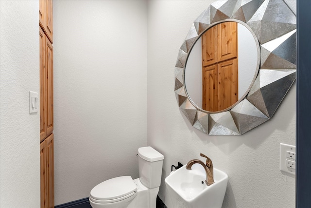 bathroom with sink and toilet