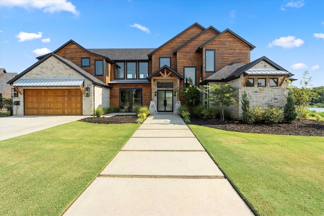 view of front of home featuring a garage and a front lawn