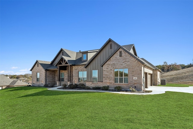 craftsman house featuring a garage and a front yard