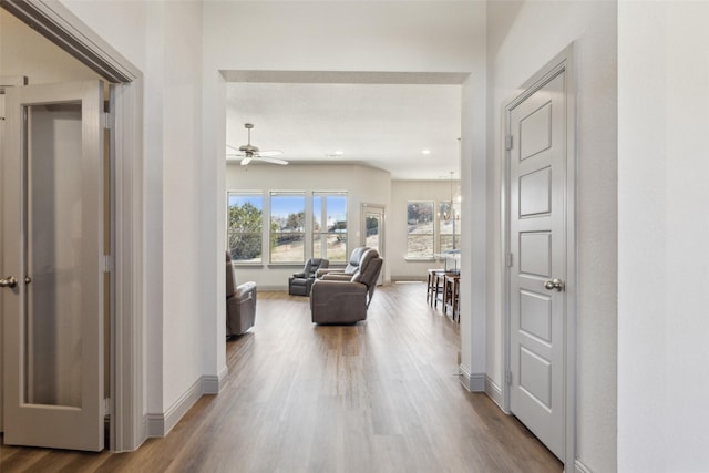 hallway with hardwood / wood-style floors