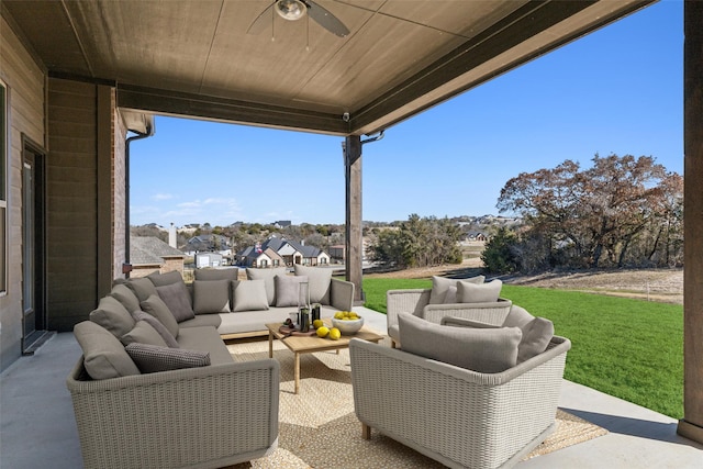 view of patio with an outdoor living space and ceiling fan