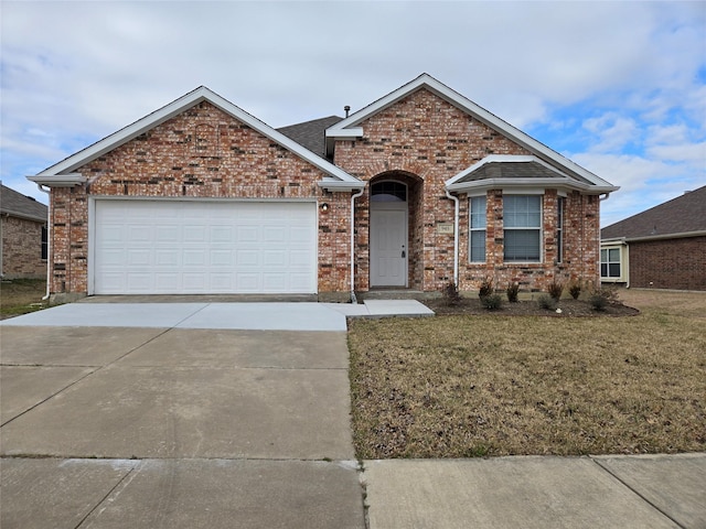 view of front facade with a garage and a front yard