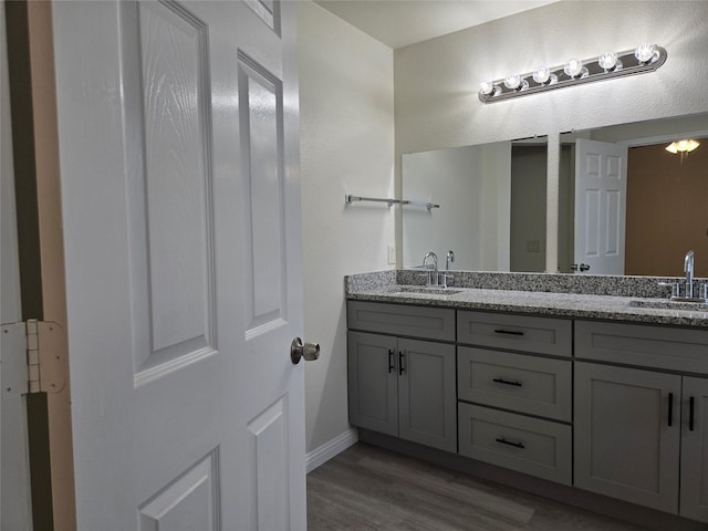 bathroom featuring vanity and hardwood / wood-style floors