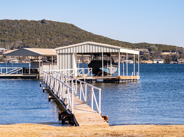 dock area featuring a water and mountain view