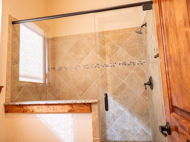 bathroom with a tile shower