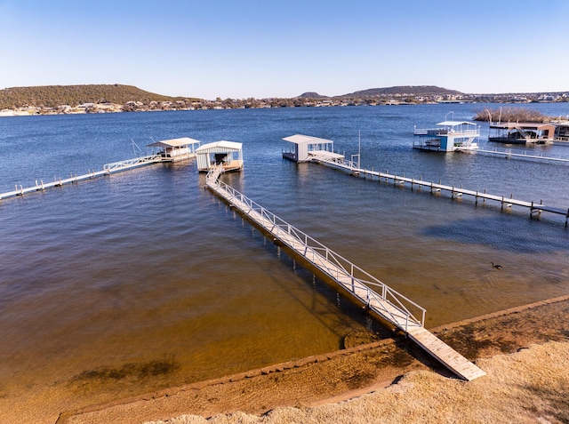 dock area with a water and mountain view