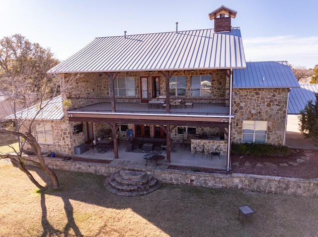 rear view of property with a patio