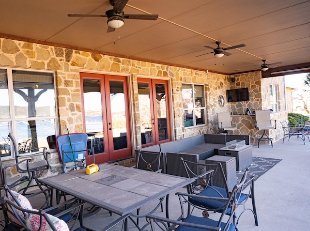 view of patio featuring ceiling fan and french doors