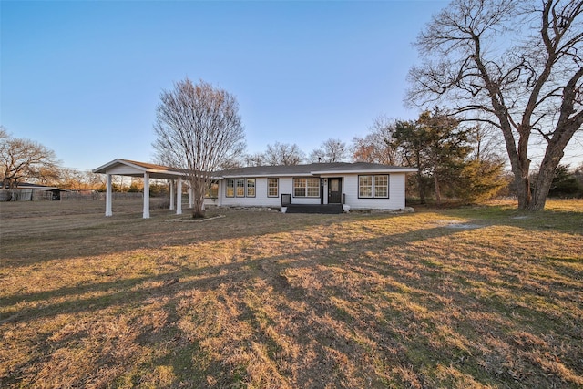 ranch-style home with a front lawn