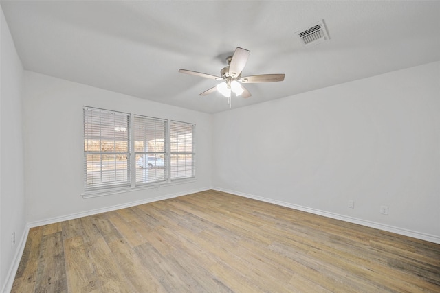 unfurnished room featuring ceiling fan and light hardwood / wood-style flooring