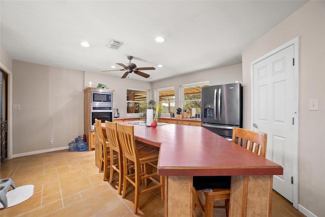 dining space with ceiling fan