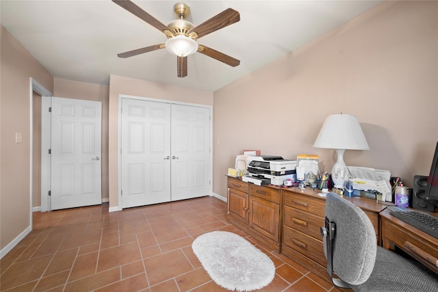 tiled office featuring ceiling fan