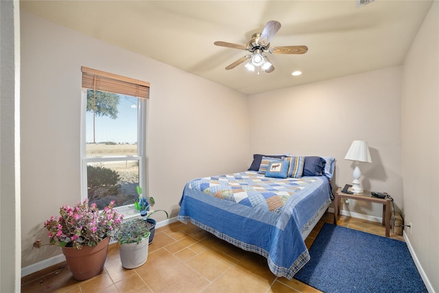 tiled bedroom with ceiling fan