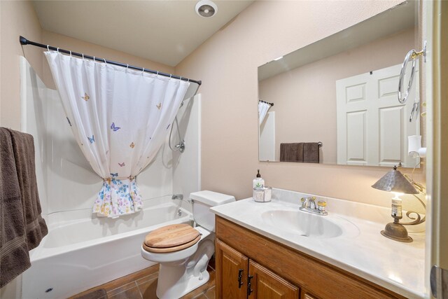 full bathroom featuring vanity, tile patterned flooring, shower / bath combo, and toilet