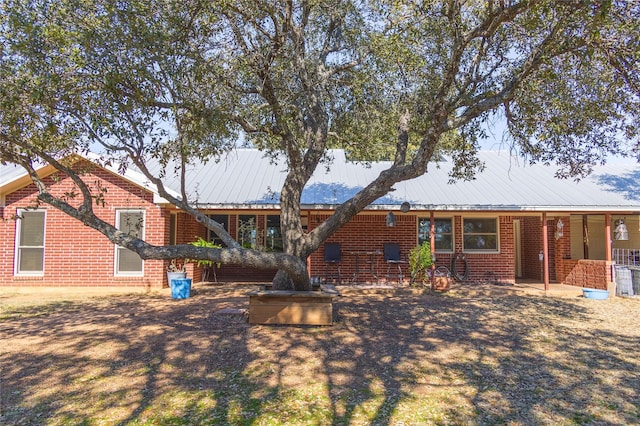 rear view of property featuring a patio area