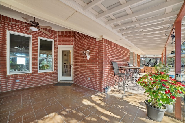 view of patio featuring ceiling fan