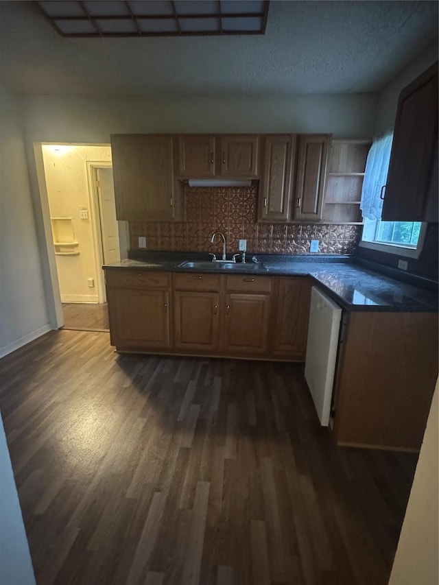 3033 Anita Dr, Garland, TX 75041 - kitchen with a sink, dark countertops, tasteful backsplash, and dark wood-style flooring