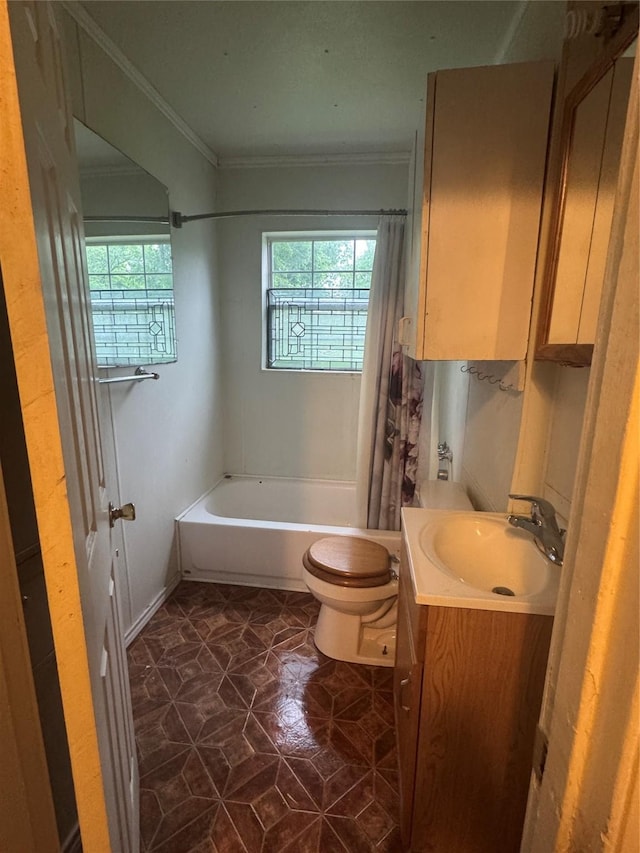 3033 Anita Dr, Garland, TX 75041 - full bathroom featuring toilet, plenty of natural light, ornamental molding, and shower / bath combo