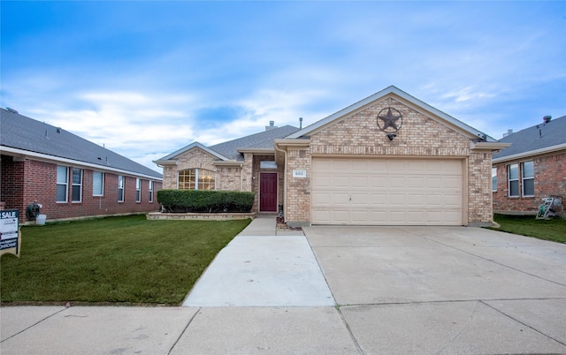 ranch-style home featuring a garage and a front yard