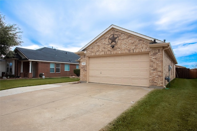 view of front facade with a garage and a front yard