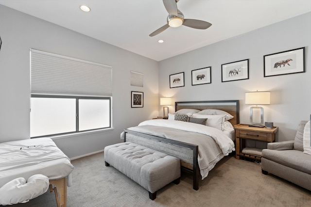 bedroom featuring light colored carpet and ceiling fan