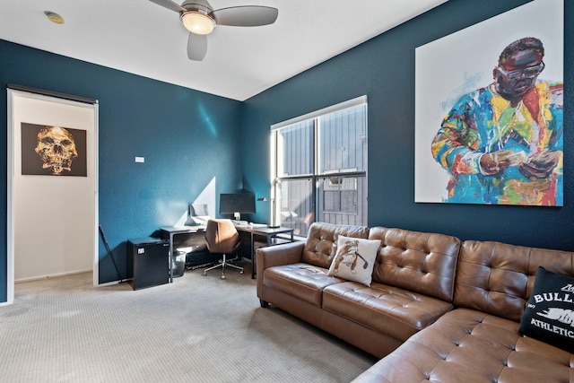 living room with ceiling fan and carpet