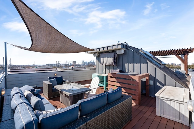 wooden terrace with an outdoor living space