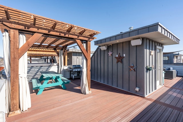 wooden deck featuring area for grilling