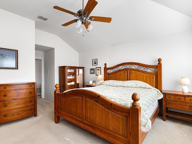 bedroom with light carpet, lofted ceiling, and ceiling fan