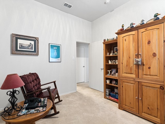 living area with light carpet