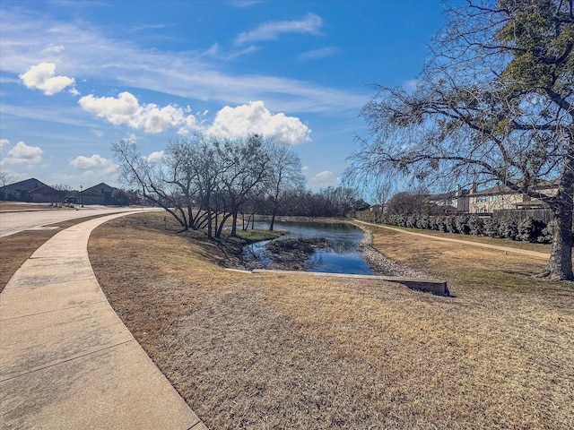 view of property's community with a water view