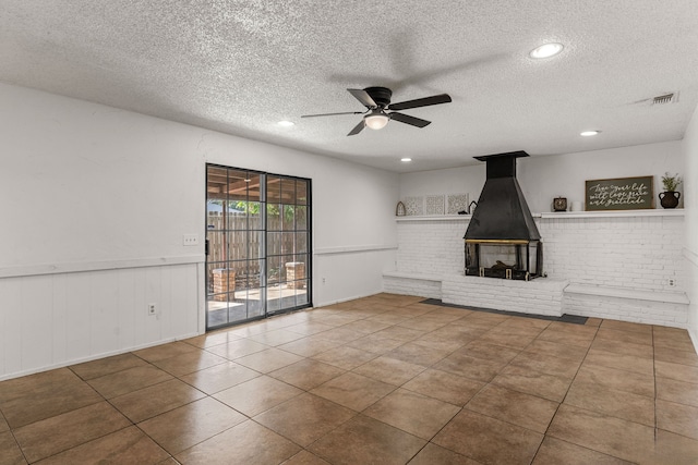 2920 Cunningham Dr, Wichita Falls, TX 76308 - unfurnished living room with ceiling fan, tile patterned floors, and a textured ceiling