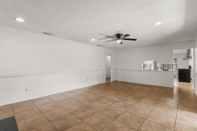 2920 Cunningham Dr, Wichita Falls, TX 76308 - tiled spare room featuring ceiling fan and a textured ceiling