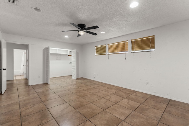 2920 Cunningham Dr, Wichita Falls, TX 76308 - spare room featuring tile patterned flooring, a textured ceiling, and ceiling fan