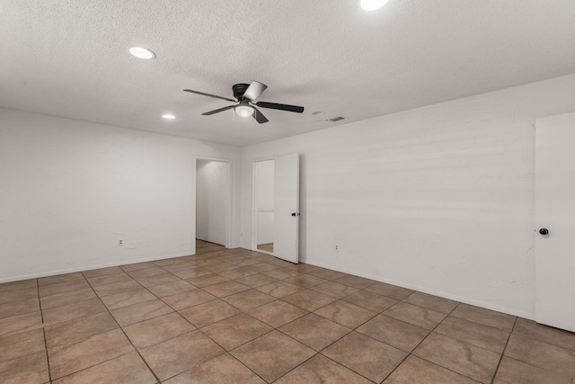 2920 Cunningham Dr, Wichita Falls, TX 76308 - tiled empty room with ceiling fan and a textured ceiling