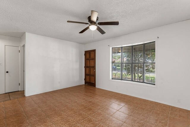 2920 Cunningham Dr, Wichita Falls, TX 76308 - empty room featuring ceiling fan and a textured ceiling