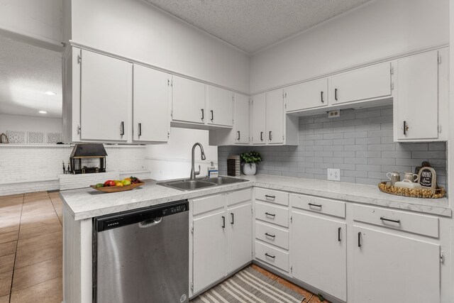2920 Cunningham Dr, Wichita Falls, TX 76308 - kitchen featuring white cabinetry, sink, backsplash, and dishwasher