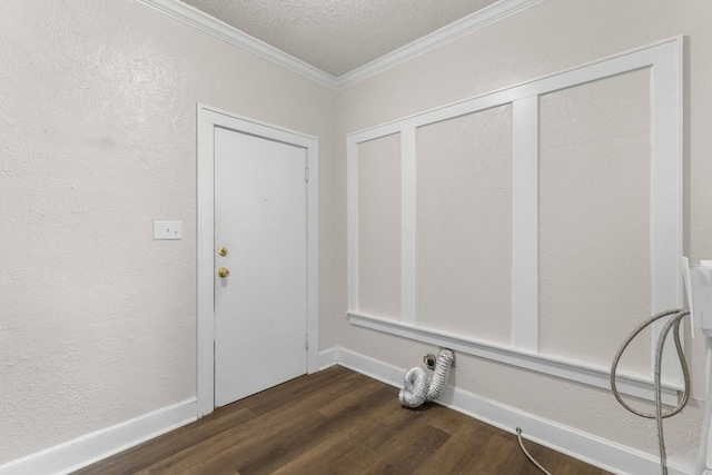 interior space featuring ornamental molding, dark hardwood / wood-style flooring, and a textured ceiling