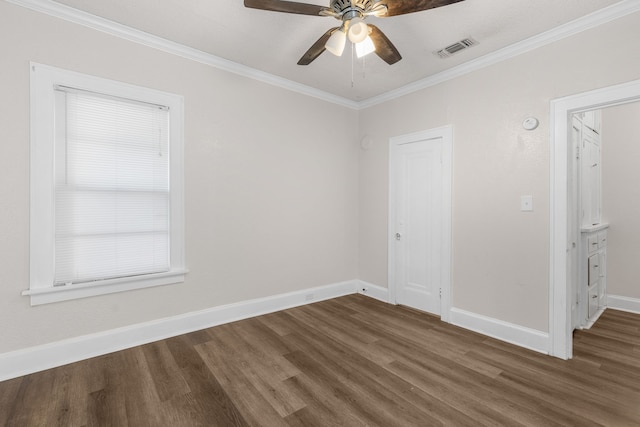 spare room featuring crown molding, ceiling fan, and wood-type flooring