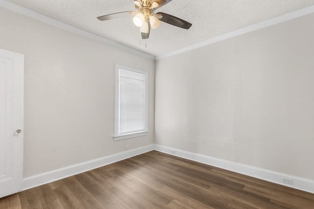 empty room with ceiling fan, crown molding, dark wood-type flooring, and a textured ceiling