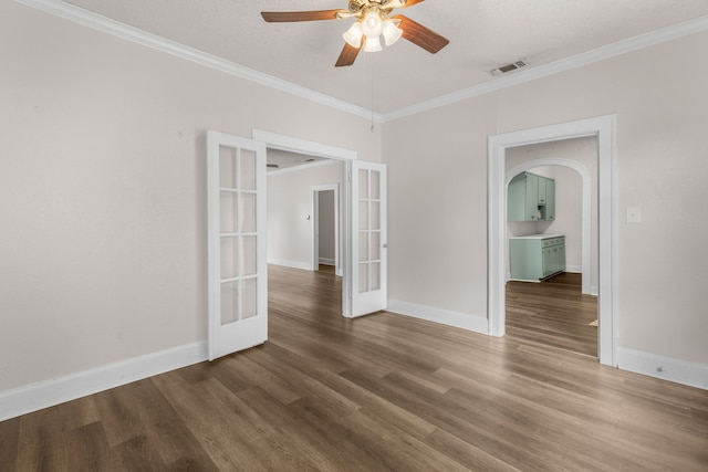 spare room featuring hardwood / wood-style flooring, ornamental molding, and french doors