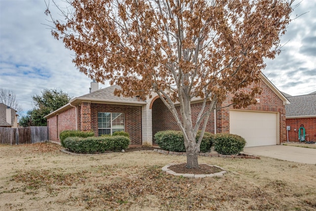 single story home featuring a garage and a front yard