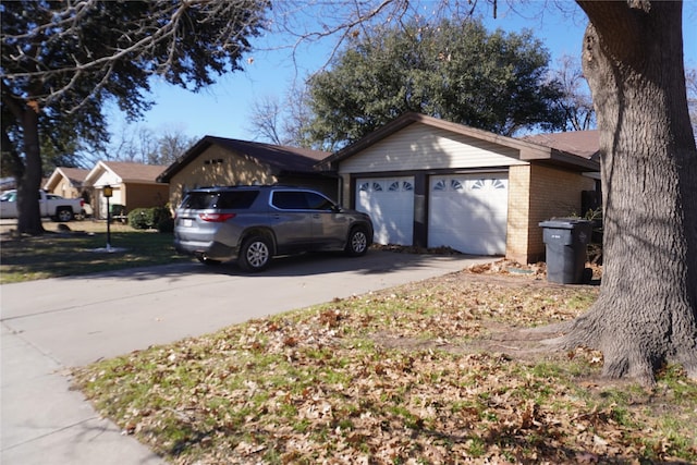 view of side of property featuring a garage